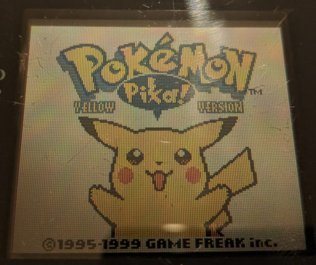 Photo of Pikachu's face on a real Game Boy Color.